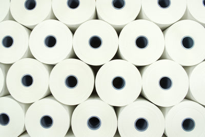 paper rolls stacked on-top of each other 